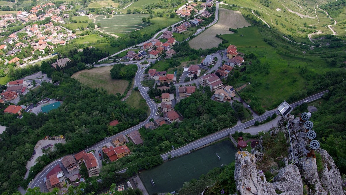 an aerial view of a town and a river